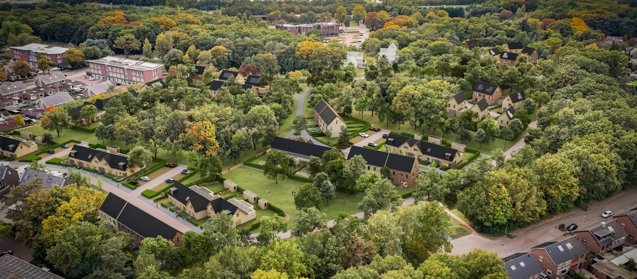 Luchtfoto van woonwijk met vrijstaande woningen, veel groen en centraal parklandschap