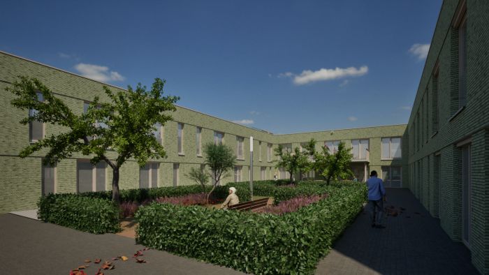 Impressie binnenhof van nieuw zorgcomplex Levanto in Kerkrade met groene tuin, paden en zitplekken voor bewoners.