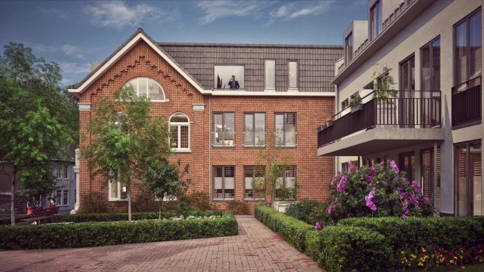 Impressie binnenhof van nieuwbouwproject ’t Oude Raadhuis Ulestraten met gerenoveerde gevel en balkons.