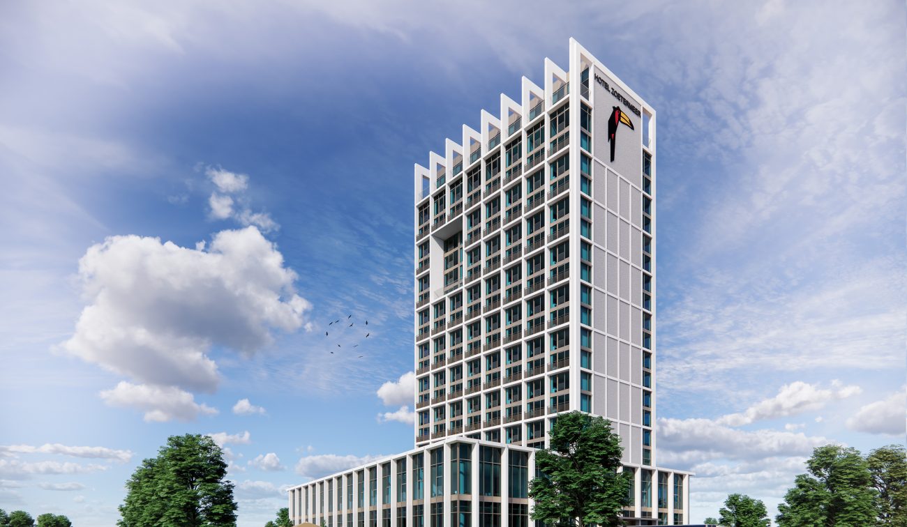 Overdagimpressie van het nieuwgebouwde Van der Valk Hotel Zoetermeer, met glazen gevel, parkeervoorziening en groene omgeving.