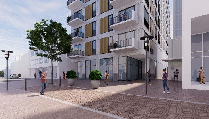 Impressie transformatie De Componist Kerkrade: glazen hoekplint, uitkragende balkons en baksteenplein