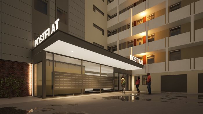 Nachtimpressie entree Postflat Venlo: verlichte luifel, glaswand met brievenbussen en natte tegels