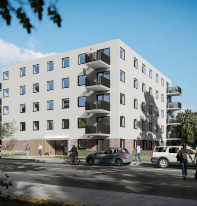 Appartementencomplex met witte gevel, balkons en fietsenstalling aan straat