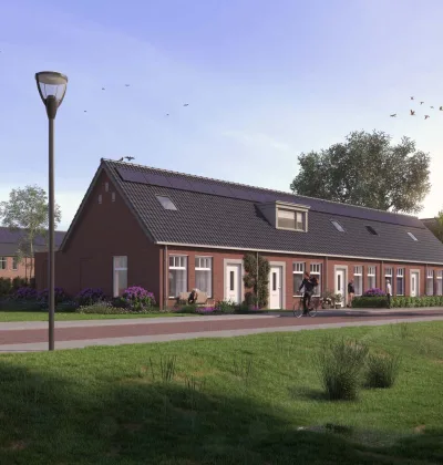 Rijwoningen met bakstenen gevels en pannendak langs fietspad en groenstrook